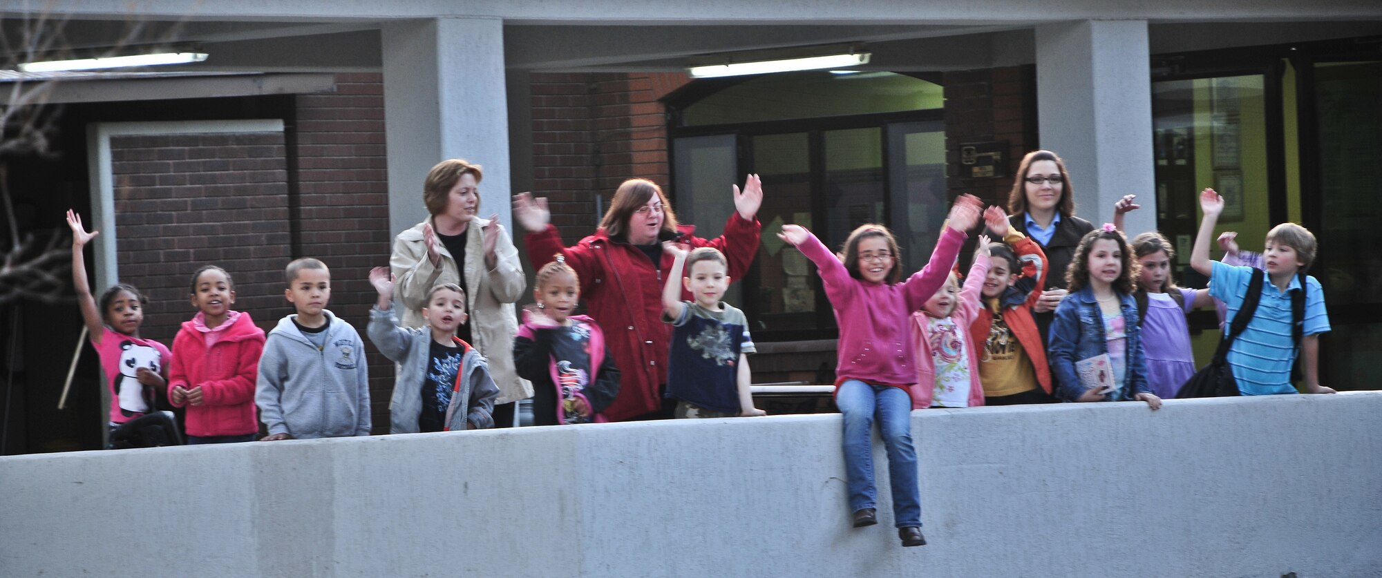 Children from the Child Development Center cheer for Airmen as they pass by during the wing run Feb. 24, 2011 at Incirlik Air Base, Turkey. The run was intended to boost morale and build camaraderie between the Airmen and was held in conjunction with resiliency training during Winter Wingman Day 2011.  (U.S. Air Force photo by Staff Sgt. Alex Montes/Released)