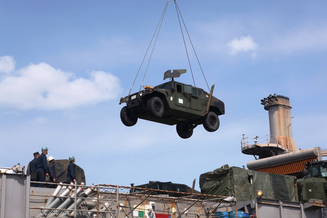 A humvee belonging to the 31st Marine Expeditionary Unit is moved from the USS Denver (LPD 9) to the USS Harpers Ferry (LSD 49), March 4.  Elements of the 31st MEU switched ships mid-deployment, allowing the MEU to remain ready to respond.  The transition comes midway through the MEU’s scheduled deployment to the Asia-Pacific region, enhancing theater security and conducting bilateral training with multiple nations.  The 31st MEU is the U.S.’s only continually forward-deployed MEU, and remains a force in readiness in the Asia-Pacific region at all times.