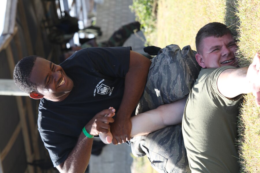 Belize Special Patrol Unit constable Osmaine Gabourel demonstrates an arm lock technique he had just learned during non-lethal weapons training upon Lance Cpl. Von Richcreek, a squad automatic weapon gunner with Company I, 3rd Battalion, 24th Marine Regiment and Nashville, Tenn., native. The training was part of exercise Tradewinds 2011.::r::::n::