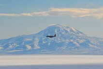 An LC-130 Ski-bird from Stratton Air National Guard Base, N.Y. flies past Mount Discovery near McMurdo Station, Antarctica, as part of Operation Deep Freeze 2010-2011. ODF is the U.S. military's operational and logistic support of the NSF's scientific research activities in Antarctica.  (U.S. Air Force photo/ Col Gary James).
