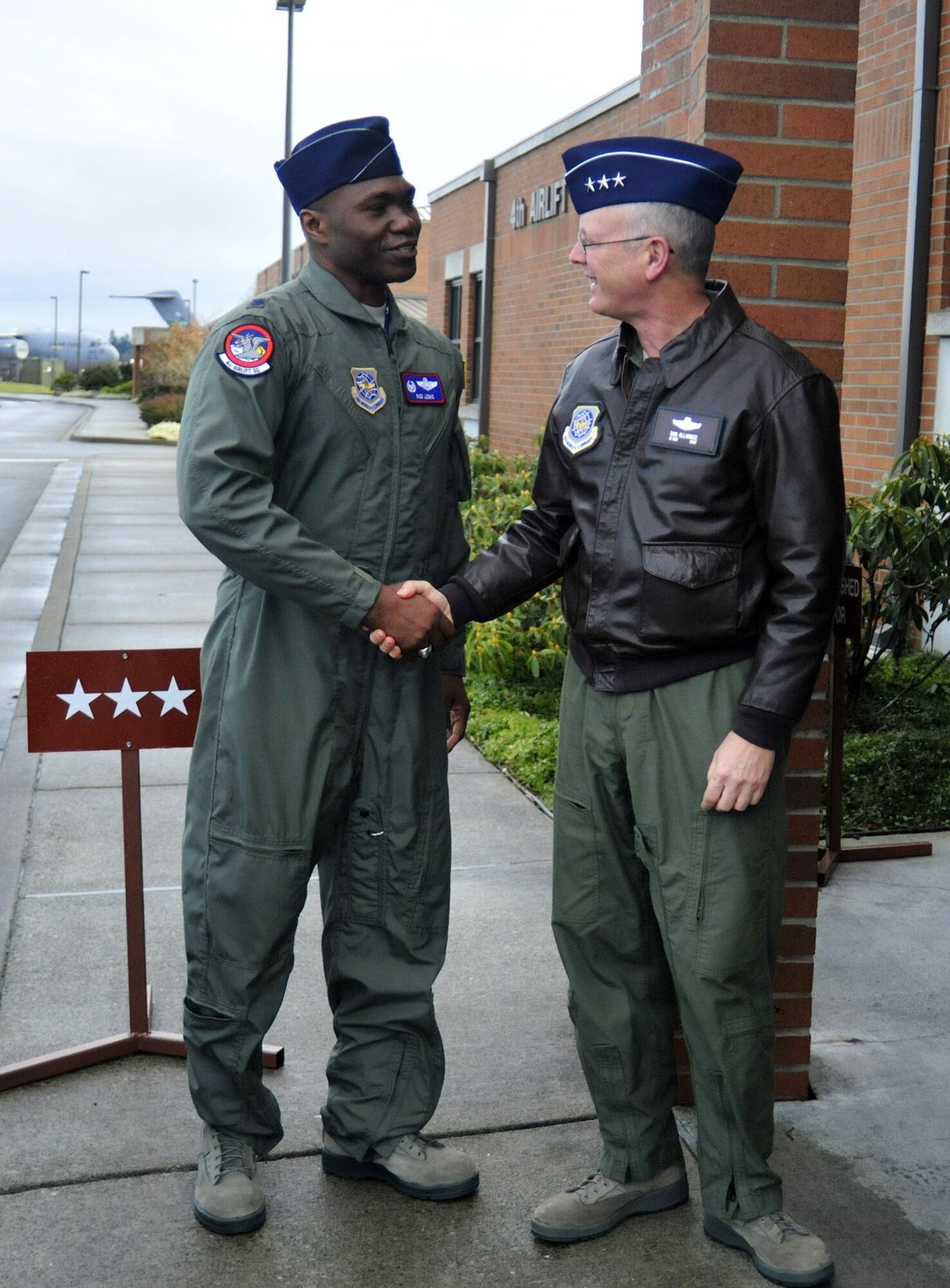 Lt. Col. Rodney Lewis, left, 4th Airlift Squadron commander, greets Lt. Gen. Robert Allardice, 18th Air Force commander, March 2, 2011, at Joint Base Lewis-McChord, Wash. (U.S. Air Force photo/Airman 1st Class Leah Young)