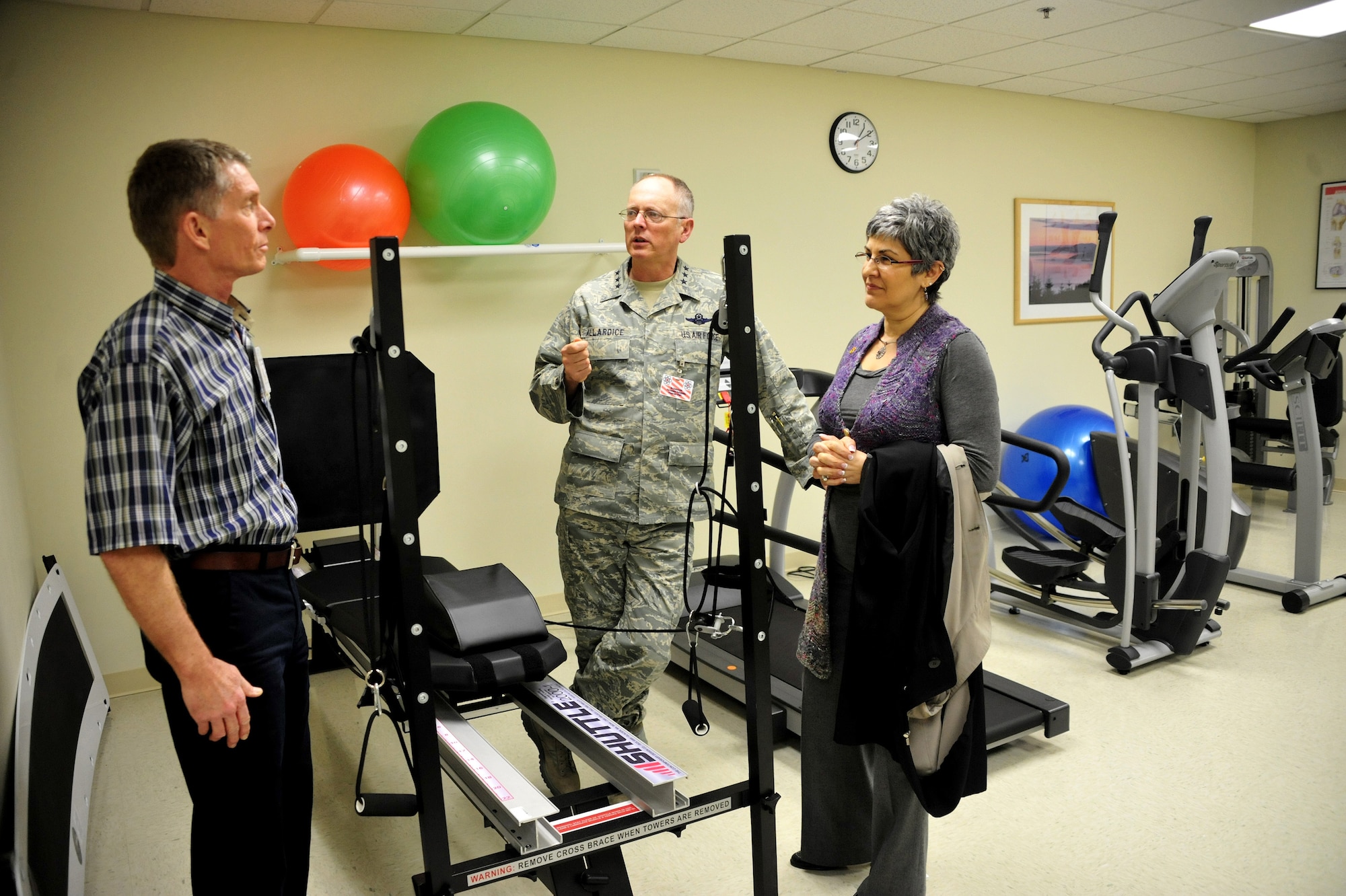 Lt. Gen. Robert Allardice, center, 18th Air Force commander, discusses the benefits of the new Physical Therapy Clinic, March 2, 2011, at Joint Base Lewis-McChord, Wash. The new clinic features equipment and programs to ensure servicemembers are fully recovered. (U.S. Air Force photo/Airman 1st Class Leah Young)