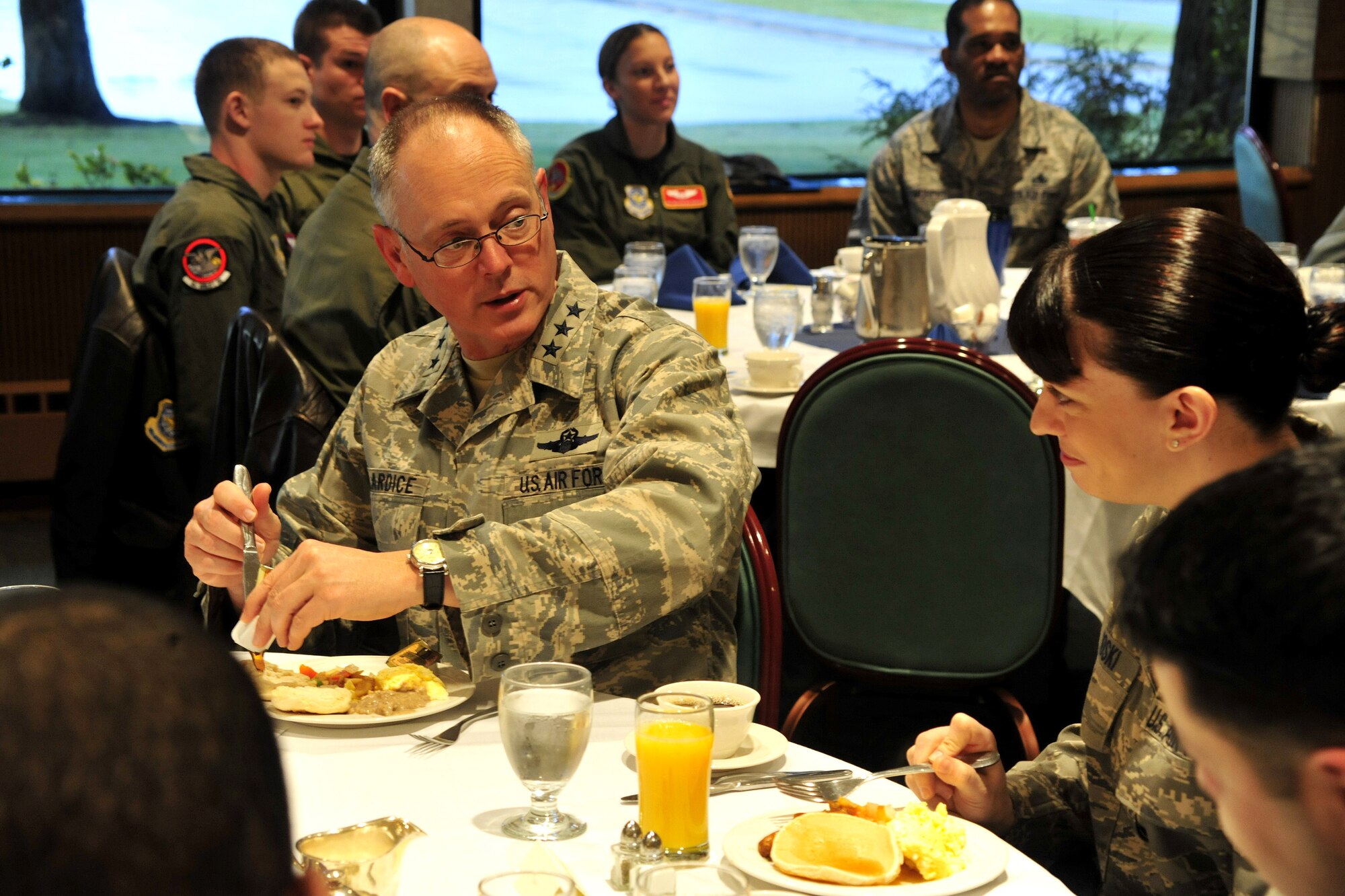 Lt. Gen. Robert Allardice, left, 18th Air Force commander, speaks to Staff Sgt. Jessica Sliwoski, 62nd Maintenance Squadron, at the Look Sharp Excellence in Leadership Breakfast, March 2, 2011, at Joint Base Lewis-McChord, Wash. General Allardice spoke with the Airmen about their hometowns and various career fields. (U.S. Air Force photo/Airman 1st Class Leah Young)