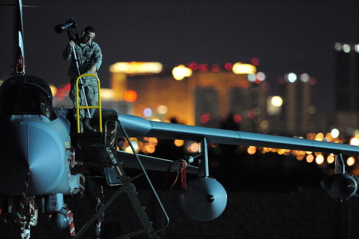 NELLIS AIR FORCE BASE, Nev. -- Airman 1st Class Daniel Hughes, 99th Air Base Wing photographer, documents  Royal Air Force Tornado GR4s on a night mission during Red Flag 11-3, at Nellis Air Force Base, Nev., March 3, 2011.  Red Flag is a realistic combat training exercise involving the air forces of the United States and its allies.  The exercise is hosted north of Las Vegas on the Nevada Test and Training Range.   (U.S. Air Force Photo by Staff Sgt. William P. Coleman)
