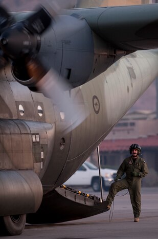 NELLIS AIR FORCE BASE, Nev. -- Royal Australian Air Force Warrant Officer Peter Kennedy, No. 37 Squadron load master, from Richmond, Australia goes over pre-flight checks on a C-130H Hercules before a training mission during Red Flag 11-3 at Nellis Air Force Base, Nev., March 3, 2011. Red Flag is a realistic combat training exercise involving the air forces of the United States and its allies. The exercise takes place north of Las Vegas on the Nevada Test and Training Range--the U.S. Air Force's premier military training area with more than 12,000 square miles of airspace and 2.9 million acres of land. (U.S. Air Force photo by Tech Sgt. Michael R. Holzworth/Released)
