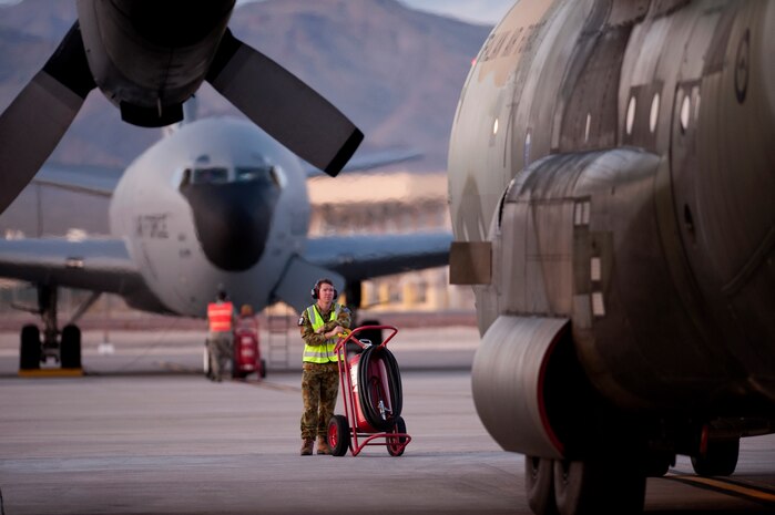 Royal Australian Air Force Leading Air Craftsman Grant Florino assigned to the No. 37 Squadron from Richmond, Australia provides safety watch during engine start up of a C-130H Hercules during Red Flag 11-3 at Nellis Air Force Base, Nev., March 3, 2011. Red Flag is a realistic combat training exercise involving the air forces of the United States and its allies. The exercise takes place north of Las Vegas on the Nevada Test and Training Range--the U.S. Air Force's premier military training area with more than 12,000 square miles of airspace and 2.9 million acres of land. (U.S. Air Force photo by Tech Sgt. Michael R. Holzworth/Released)