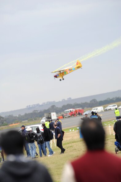 Visitors watch an aerial demonstration at the 2011 Avalon International Airshow in Geelong, Australia, March 4, 2011. The event is one of the largest airshows in the world. This year's event also celebrates the 90th anniversary of the Royal Australian Air Force. Several U.S. Air Force aircraft were displayed at the event including the F-16 Fighting Falcon, the C-17 Globemaster III, the F-22 Raptor and the C-130J Hercules. (U.S. Air Force photo/Master Sgt. Cohen A. Young)
