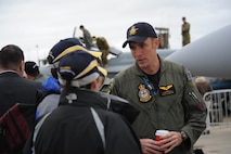 Capt. Russ Klawitter, a F/A-18F Super Hornet pilot, greets visitors to the 2011 Avalon International Airshow in Geelong, Australia, March 4, 2011. The captain is serving in an exchange program with the Royal Australian Air Force. This year's event also celebrates the 90th anniversary of the RAAF. Several U.S. Air Force aircraft were displayed at the event including the F-16 Fighting Falcon, the C-17 Globemaster III, the F-22 Raptor and the C-130J Hercules. (U.S. Air Force photo/Master Sgt. Cohen A. Young)