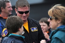 Staff Sgt. Chad Miller, a crew chief with the F-16 Demonstration Team from Misawa Air Base, Japan, interacts with visitors at the Avalon 2011 Australian International Airshow in Geelong, Australia, March 4, 2011. Several U.S. Air Force aircraft were displayed at the event including the F-16 Fighting Falcon, the C-17 Globemaster III, the F-22 Raptor and the C-130J Hercules. The event is one of the largest airshows in the world and coincides with a trade exposition. (U.S. Air Force photo/Master Sgt. Cohen A. Young)