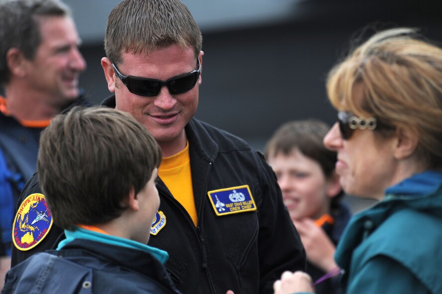 Staff Sgt. Chad Miller, a crew chief with the F-16 Demonstration Team from Misawa Air Base, Japan, interacts with visitors at the Avalon 2011 Australian International Airshow in Geelong, Australia, March 4, 2011. Several U.S. Air Force aircraft were displayed at the event including the F-16 Fighting Falcon, the C-17 Globemaster III, the F-22 Raptor and the C-130J Hercules. The event is one of the largest airshows in the world and coincides with a trade exposition. (U.S. Air Force photo/Master Sgt. Cohen A. Young)