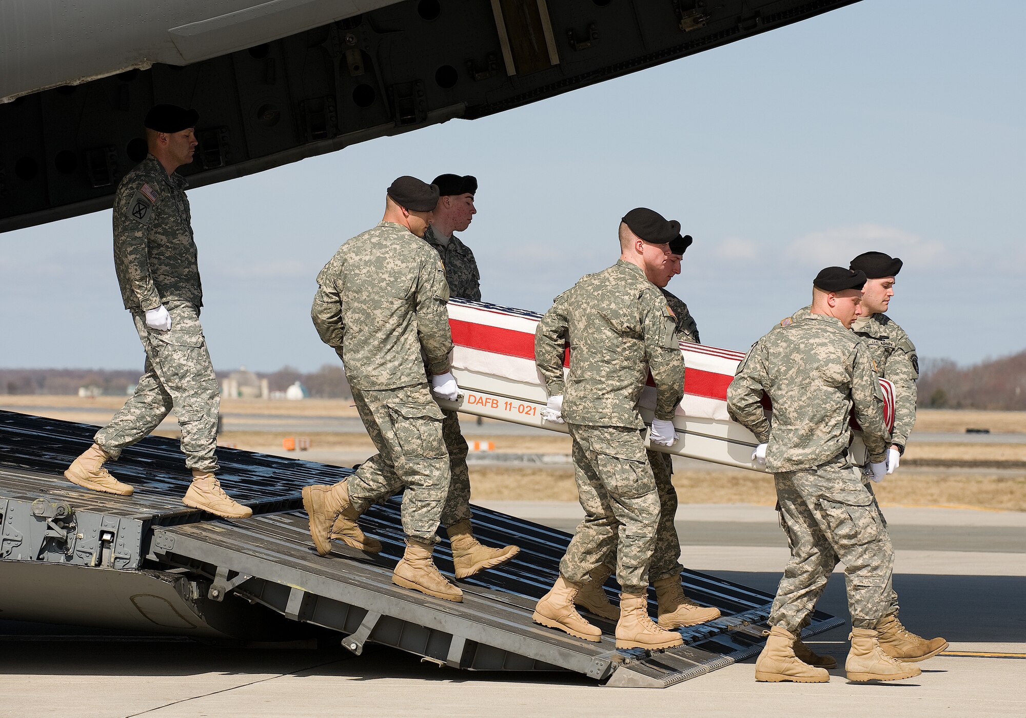 A U.S. Army carry team transfers the remains of Army Spc. Christopher G. Stark of Monett, MO., at Dover Air Force Base, Del., March 4, 2011. (U.S. Air Force photo/Jason Minto)