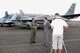 GPCAPT Joe Iervasi (left), Group Captain of the 81st Wing, Royal Australian Air Force (RAAF) Base, Williamtown, Australia, is interviewed by members of the Australian NBN TV news channel during a press conference held at the RAAF Williamtown on March 4, 2011; a KC-135 aircraft from the 185th Aerial Refueling Wing (185ARW), Sioux City, Iowa, an F-18 aircraft, from the RAAF Williamtown, and an F-16 aircraft, from the 132nd Fighter Wing (132FW), Des Moines, Iowa, are seen behind him.  The 132FW and 185ARW are currently deployed in Australia for joint flying mission, 