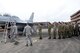 Members of the 132nd Fighter Wing (132FW), Des Moines, Iowa Maintenance Group (left) work with members of the Royal Australian Air Force (RAAF) Cadets (right) and show them a little about the 132FW F-16 aircraft during joint flying operation, 