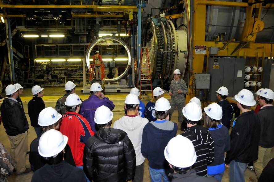 During engineer-for-a-day activities Feb.23, Capt. Scott Rinella shows students the Aeropropulsion Systems Test Facility (ASTF) C-2, where aircraft engines are tested. (Photo by Rick Goodfriend)