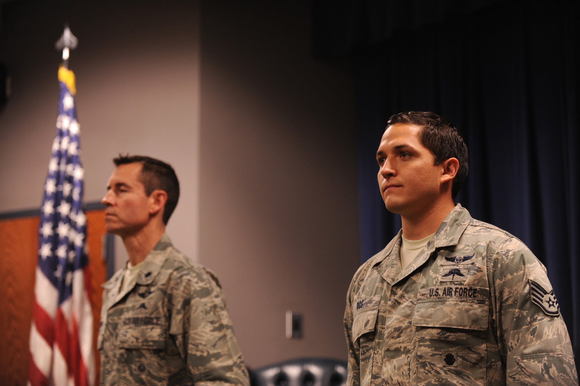 MOODY AIR FORCE, Ga. -- Staff Sgt. Andrew Rios, 38th Rescue Squadron pararescueman, stands at attention during the reading of a citation at the Senior Airman Jason D. Cunningham Airman Leadership School March 4. Sergeant Rios earned a Bronze Star Medal with Valor because of his selfless actions during a 2009 deployment to Afghanistan. (U.S. Air Force photo/Airman 1st Class Douglas Ellis)(RELEASED)
