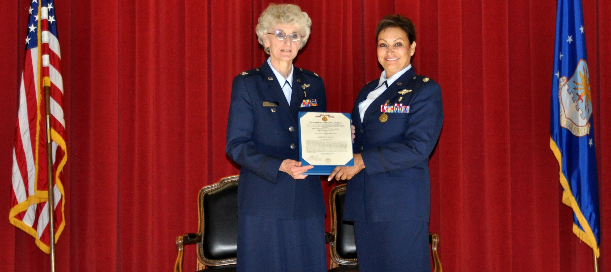 A Final Achievement: Col. Nancy Driscoll presents Lt. Col. Emma Faulk with a Meritorious Service Medal during Colonel Faulk's retirement ceremony, Feb.26.  (U.S. Air Force photo/ Staff Sgt. Kevin Chandler)