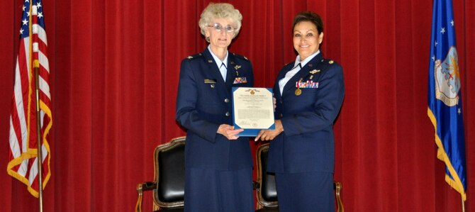 A Final Achievement: Col. Nancy Driscoll presents Lt. Col. Emma Faulk with a Meritorious Service Medal during Colonel Faulk's retirement ceremony, Feb.26.  (U.S. Air Force photo/ Staff Sgt. Kevin Chandler)
