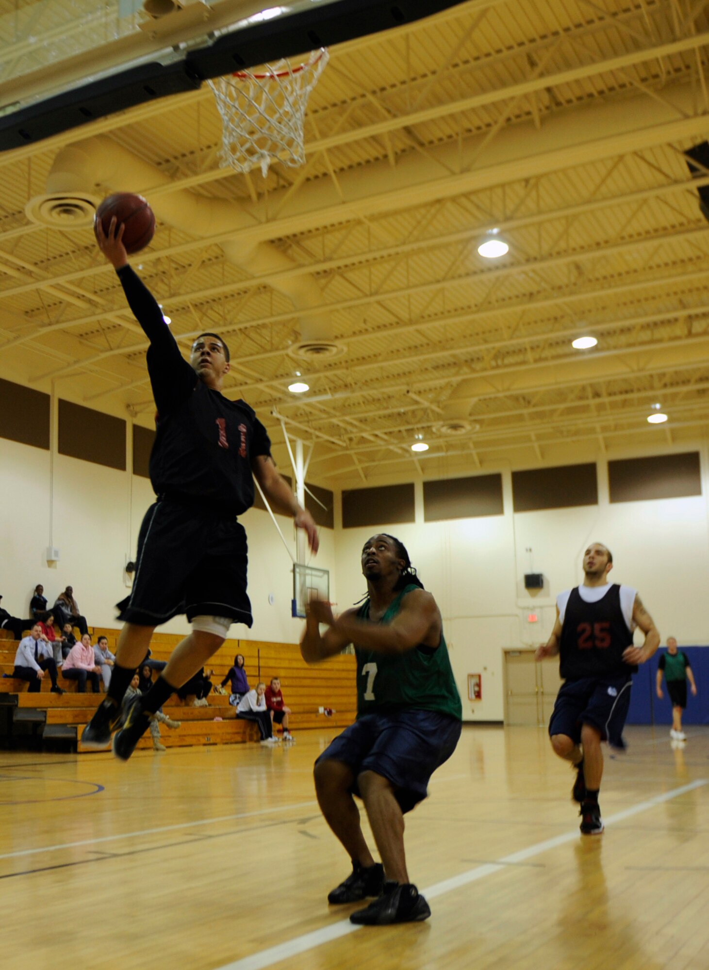 MOUNTAIN HOME AIR FORCE BASE, Idaho – David Drake, 366th Logistics Readiness Squadron’s point guard, goes for a wide open layup during the intramural basketball championship against the366th Civil Engineering Squadron Feb. 28. LRS won their fourth consecutive championship, beating out LRS 58-44. (U.S. Air Force photo by Airman 1st Class Renishia Richardson)