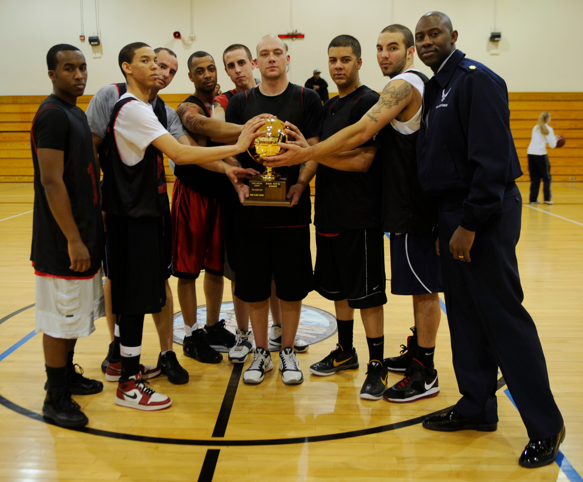 MOUNTAIN HOME AIR FORCE BASE, Idaho -- Maj. Jamaal Mays, 366th Logistics Readiness Squadron commander, poses with his championship team Feb. 28. LRS has been the team to beat for the past four seasons, and beat the 366th Civil Engineering Squadron 58-44. (U.S. Air Force photo by Airman 1st Class Renishia Richardson)
