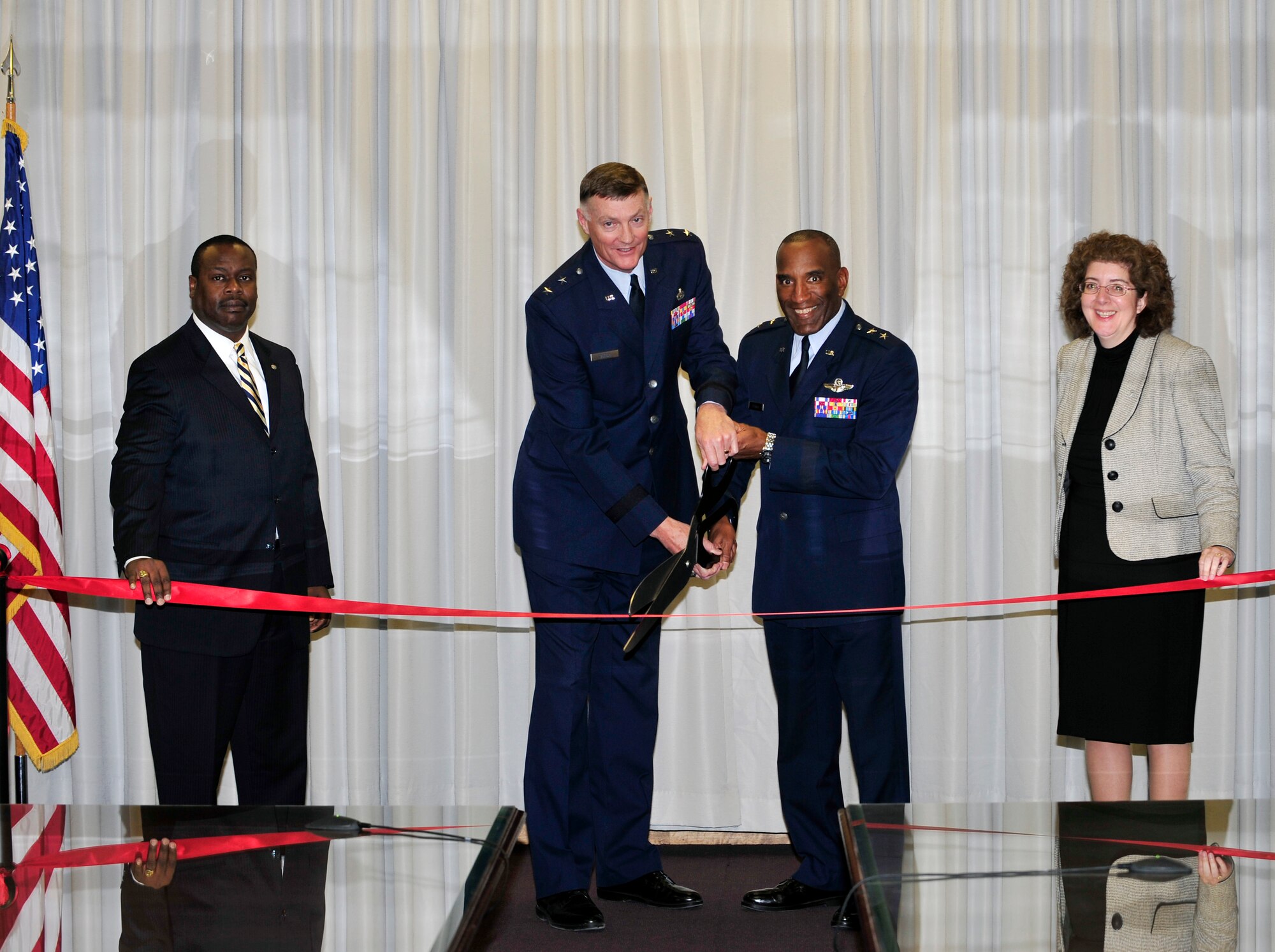 (Left to right) Air Force Materiel Command Headquarters Personnel Division Chief Eric Dilworth, Ogden Air Logistics Center Commander Maj. Gen. Andrew Busch, Air Force Personnel Center Commander Maj. Gen. A.J. Stewart, and AFPC Civilian Force Integration Director Michelle LoweSolis cut the ribbon on the new AFPC Operating Location at Hill Feb. 28. (U.S. Air Force photo by Kim Cook)