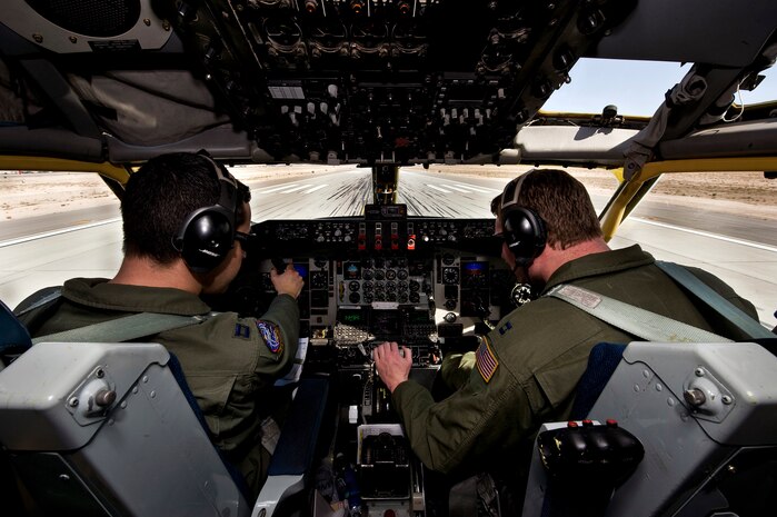NELLIS AIR FORCE BASE, Nev. --  Capt. Jose Vergara and Capt. Dave Perry, 22th Air Refueling Wing KC-135 Stratotanker pilots, McConnell Air Force Base, Kan., prepare to depart for a training mission over the Nevada Test and Training Range during Red Flag 11-3, March 3. Red Flag is a realistic combat training exercise involving the air forces of the United States and its allies. The exercise is hosted north of Las Vegas on the Nevada Test and Training Range.(U.S. Air Force photo by Senior Airman Brett Clashman)