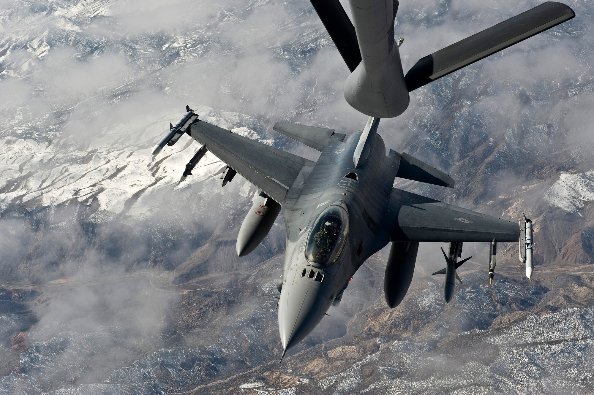NEVADA TEST AND TRAINING RANGE -- A U.S. Air Force F-16 Fighting Falcon, 20th Fighter Wing, Shaw Air Force Base, S.C., pulls up for air refueling during Red Flag 11-3, March 2. Red Flag is a realistic combat training exercise involving the air forces of the United States and its allies. The exercise is hosted north of Las Vegas on the Nevada Test and Training Range.(U.S. Air Force photo by Senior Airman Brett Clashman)
