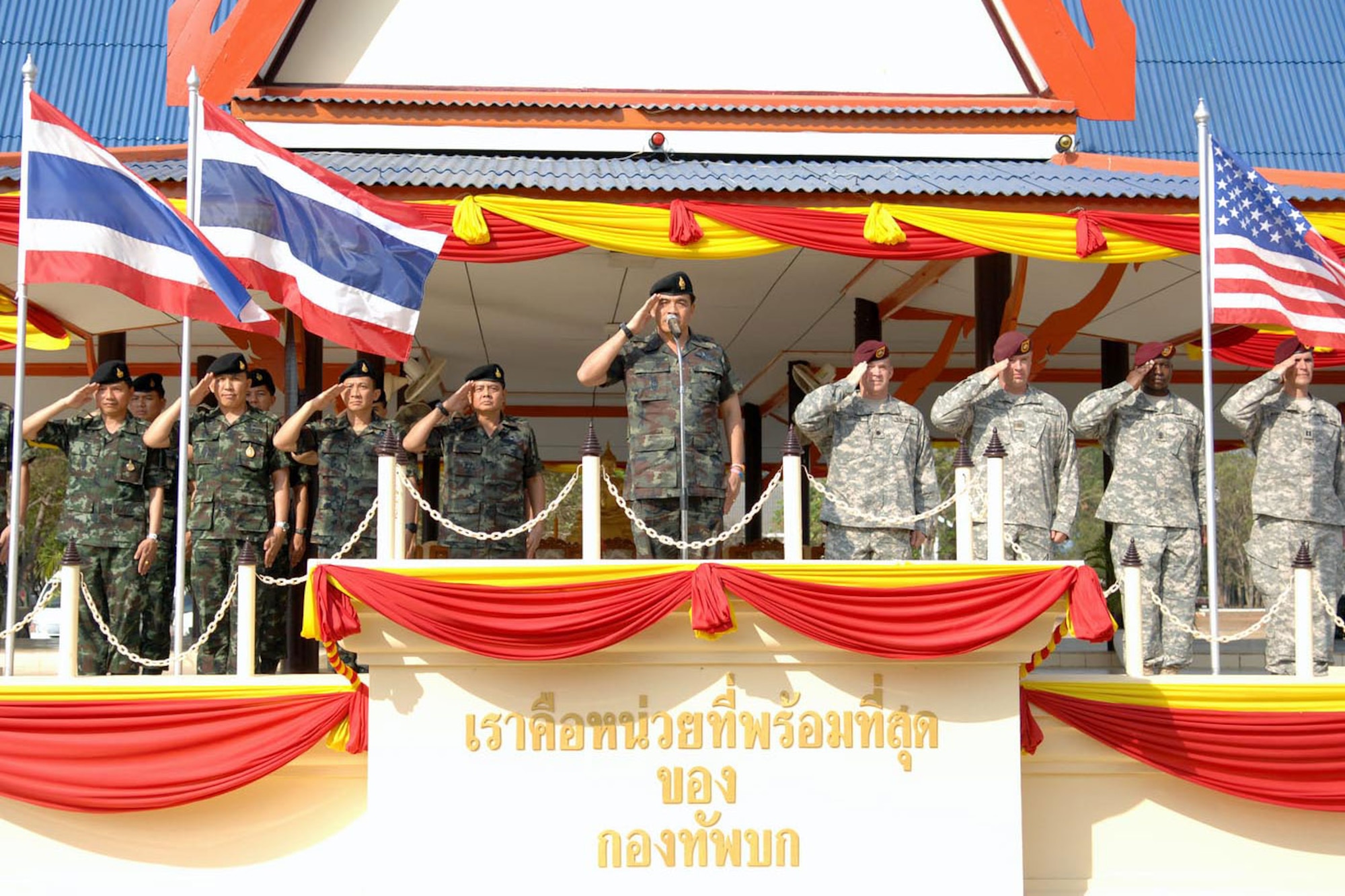 The Thai and U.S. command elements present arms along with Maj. Gen. Kampanart Ruthdit, the commanding general of the Royal Thai Army’s 1st Division, during the Feb. 17 closing ceremony of Exercise Cobra Gold 2011. (U.S. Army  photo/Staff Sgt. Matthew E. Winstead)