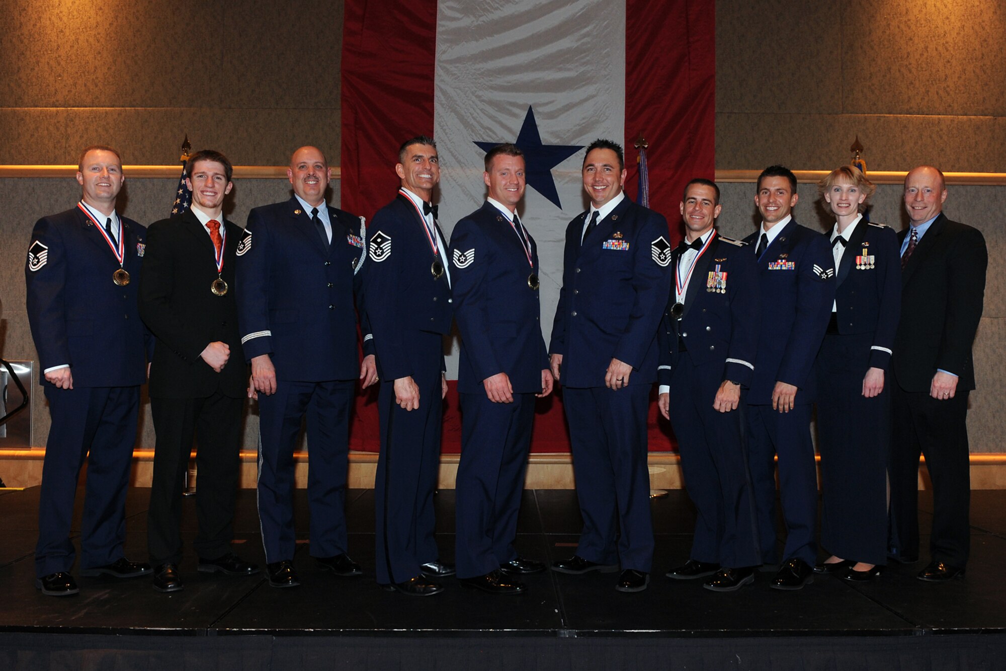 Winners of the 419th Fighter Wing's Outstanding Airmen of the Year awards include (from left to right): Master Sgt. Drue Titensor, Cooper Remkes, Master Sgt. Dave Graham, Master Sgt. Chris Sayre, Tech. Sgt. Ronald Beard, Master Sgt. Mark Bates, Capt. Shad Stromberg, Senior Airman Sterling Broadhead, Capt. Jill Scott and Brian Cink. Not pictured: Tech. Sgt. Justin Adams. 