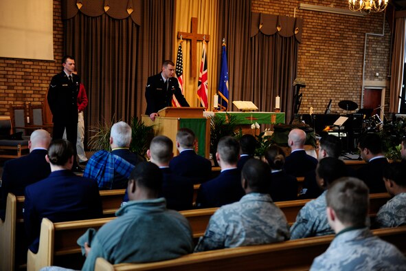 Airman 1st Class Ezekiel Greene, 423rd Security Force Squadron, talks about the kindness and generosity of Airman 1st Class Christoffer Johnson during a memorial service for Airman Johnson at the RAF Alconbury Chapel March 4.  Airman Johnson died Feb. 17 while on final security patrol in Southwest Asia.  (U.S. Air Force photo/Tech. Sgt. John Barton)