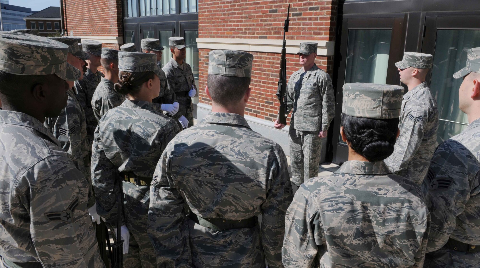 Airman 1st Class Kylee Cook, ceremonial guardsman in The U.S. Air Force Honor Guard, demonstrates how to hold the stock of the rifle Mar. 2 at Joint Base Anacostia-Bolling, Washington, D.C. During the Hour Guard’s technical training school, the trainee’s learn four drills within the eight-week course. “At the end of tech school they’ll know drills one through four,” said Senior Airman Leonard Brower, a training course supervisor with The USAF Honor Guard. (U.S. Air Force photo by Senior Airman Christopher Ruano)