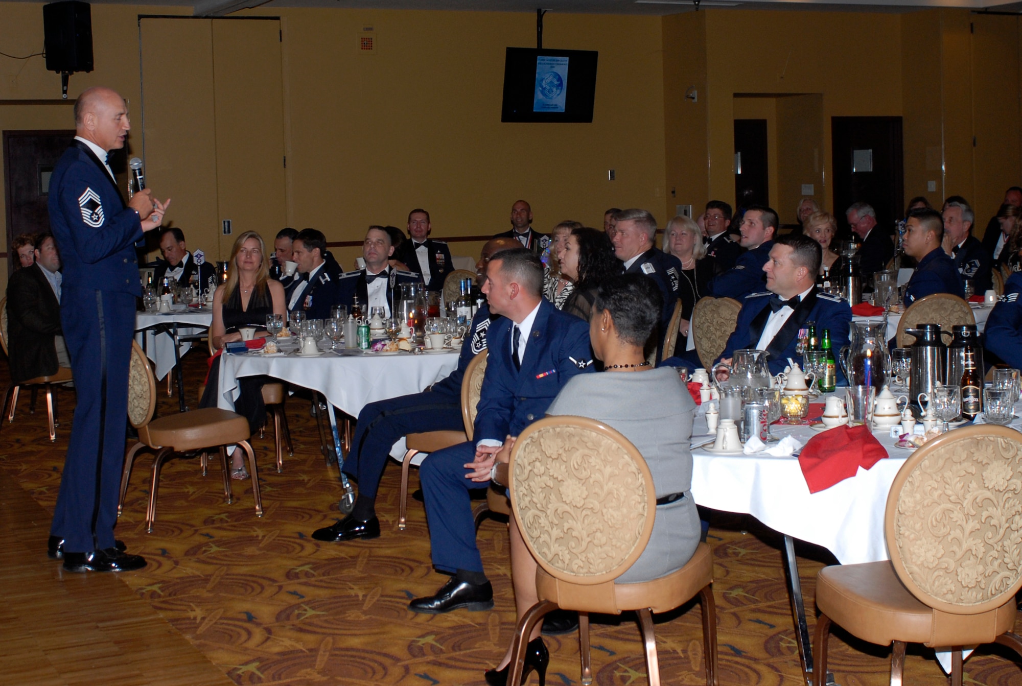 Retired Chief Master Sgt. Steve Sullens, guest speaker and former command chief for Air Combat Command, relays the importance of today’s Airmen and their families during the Chief Recognition Ceremony Feb. 25th at Club Five Six, Luke Air Force Base, Arizona.   (U.S. Air Force photo/Airman 1st Class Sandra Welch)