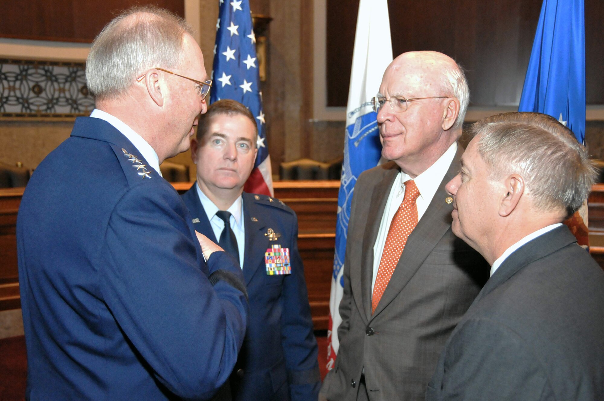 Co-chairs of the Senate National Guard Caucus, Sen. Patrick Leahy, of Vermont (left center), and Sen. Lindsey Graham, of South Carolina (right center), talk with Gen. Craig McKinley (right) and Gen. Michael Dubie, after Senators Leahy and Graham spoke to fellow senators and senior National Guard leaders Mar. 3, 2011. General McKinley is the chief of the National Guard Bureau. General Dubie is the adjutant general for the state of Vermont. (U.S. Air Force photo/Tech. Sgt. John Orrell)
