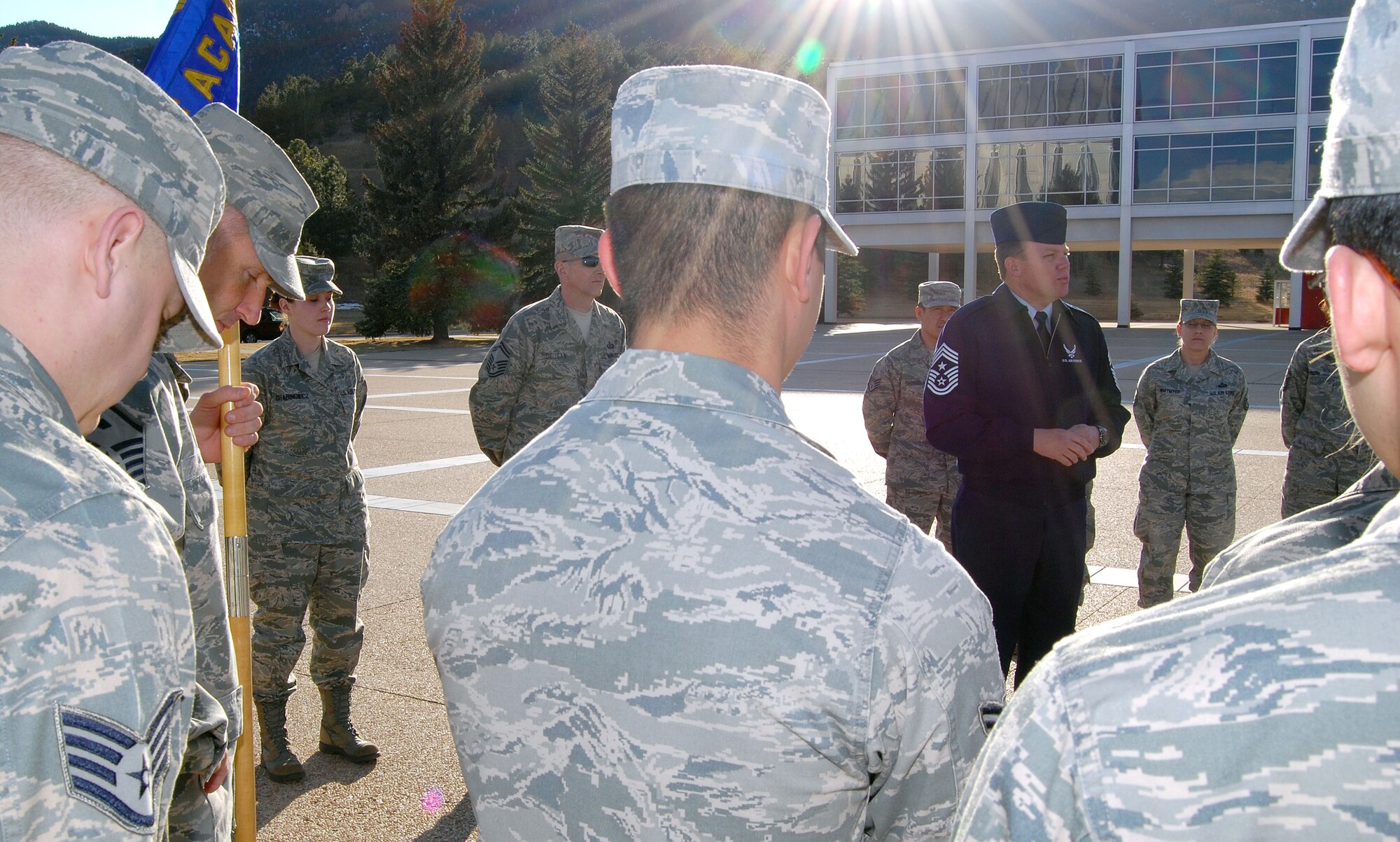 Chief Master Sgt. Todd Salzman talks to enlisted Airmen about going "back to basics" outside Harmon Hall at the Air Force Academy before a retreat ceremony March 3, 2011. Chief Salzman is the Academy's command chief master sergeant. (U.S. Air Force photo/Staff Sgt. Don Branum)