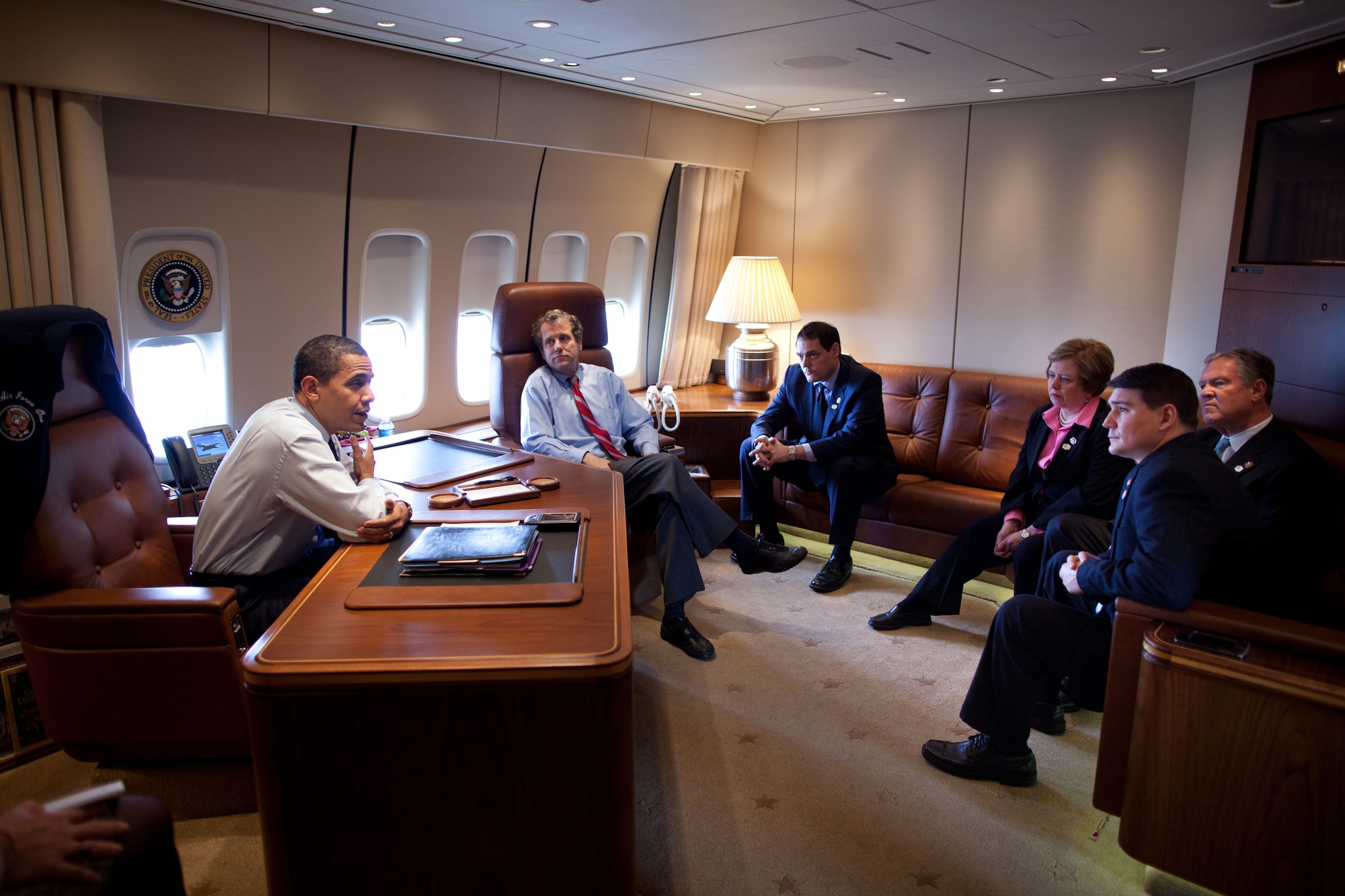 Congressman (and Air Force Reserve Maj.) John Boccieri talks with President Barack Obama as well as Senator Sherrod Brown, Congressman Zach Space and congresswoman Mary Jo Kilroy aboard Air Force One en route to Columbus, Ohio, March 6, 2009.After a two-year term in the U.S. House of Representatives, the former legislator has returned to the 910th Airlift Wing’s 773rd Airlift Squadron to resume his duties as a C-130 pilot and aircraft commander. Official White House Photo by Pete Souza
