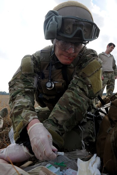 VALDOSTA, Ga.-- Senior Airman Dustin Gorski, 38th Rescue Squadron pararescueman, prepares an  intravenous needle to administer medicine to a patient during recent medevac training. The pararescuemen were evaluated on their performance and given feedback after the training. (U.S. Air Force photo/Airman 1st Class Benjamin Wiseman)(RELEASED)