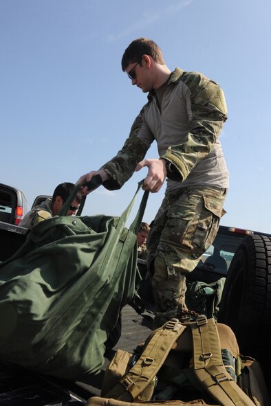 VALDOSTA, Ga.-- Senior Airman Alexander Williams, 38th Rescue Squadron pararescueman, unloads equipment before conducting medical evacuation  training recently. Pararescuemen from the 38th RQS perform routine training to stay current on their certifications. (U.S. Air Force photo/Airman 1st Class Benjamin Wiseman)(RELEASED)