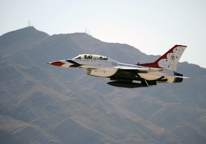 Lt. Col. Jason Koltes, Thunderbird 7, U.S. Air Force Air Demonstration Squadron "Thunderbirds" Operations Officer, and NASCAR driver Carl Edwards, take off in the F-16D Fighting Falcon at Nellis Air Force Base, Nev., Mar. 3. Edwards, who drives the #99 car, will compete in NASCAR races March 5-6 at the Las Vegas Motor Speedway.(U.S. Air Force Photo/Staff Sgt. Larry E. Reid Jr., Released)