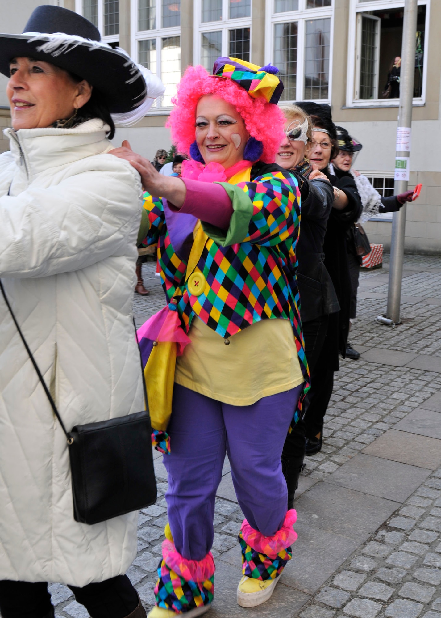 BITBURG, Germany—Women dress in colorful costumes and capture the city hall here March 3. After capturing the city hall, the women parade through the city’s streets. In most German cities and towns, including Bitburg, Wittlich and Speicher, it is a tradition for the ladies to “capture” the local city halls and take the city key from the mayor. This occurs at 11:11 a.m. Fat Thursday. (U.S. Air Force photo/Airman 1st Class Brittney Frees)