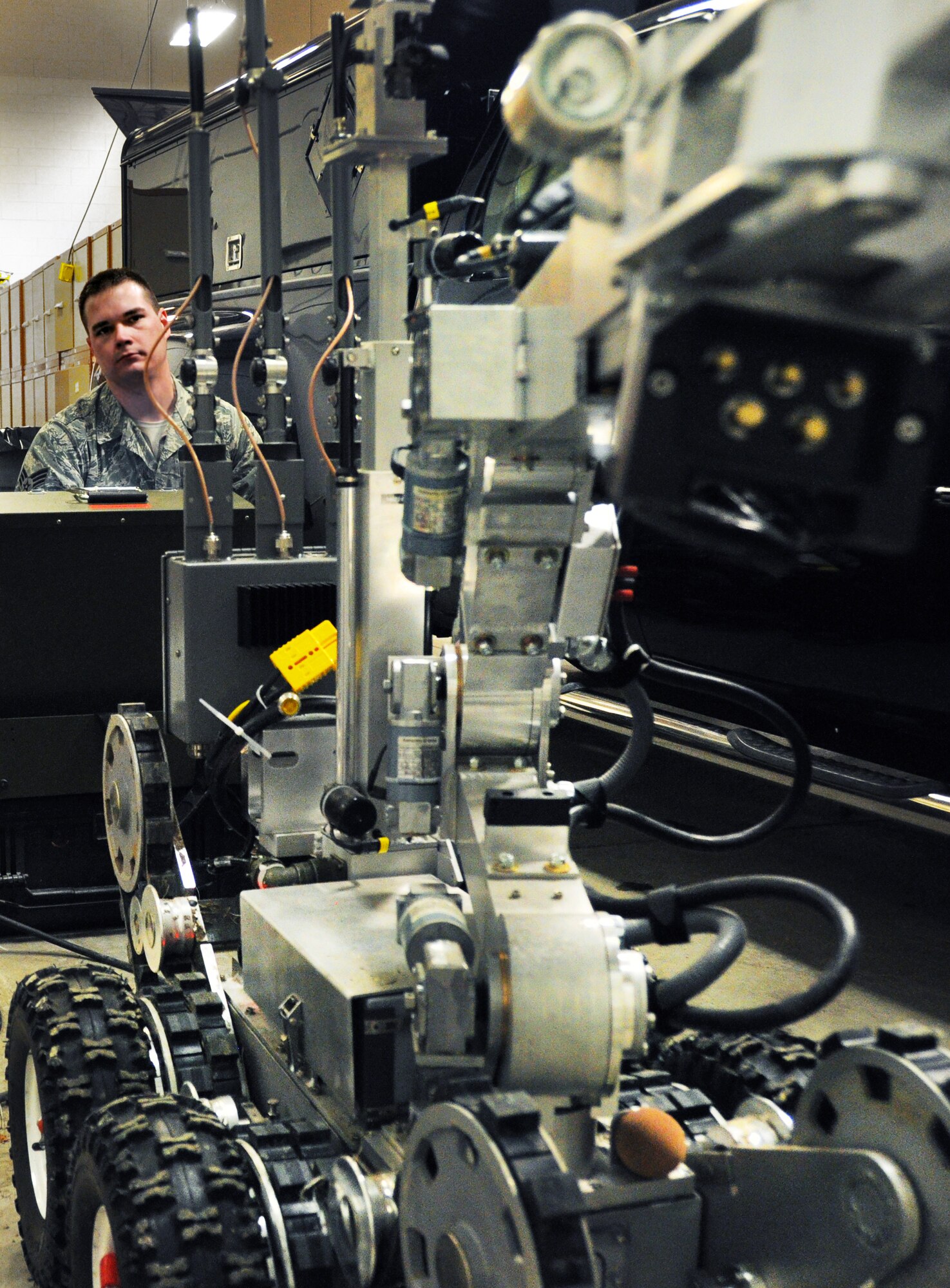 Senior Airman Michael Kupari, 419th Explosive Ordnance Disposal, demonstrates how the EOD robot can pick up potentially harmful items while the operator stays at a safe distance. (U.S. Air Force photo/Airman Crystal Charriere)
