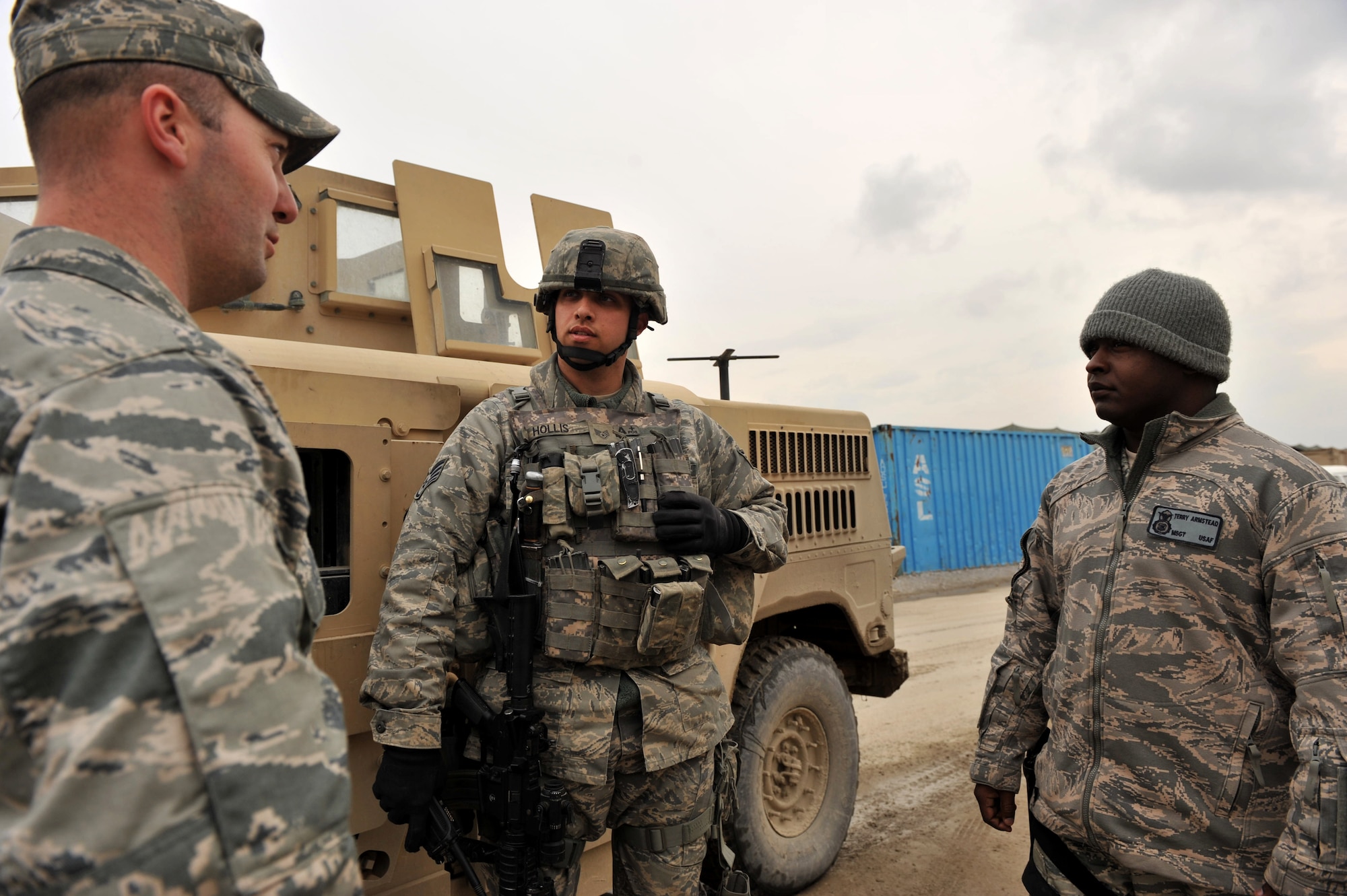 Capt. John Sieps and Master Sgt. Terry Armstead, 455th Air Expeditionary
Wing anti-terrorism office, discuss perimeter security with Staff Sgt.
Daniel Hollis, 455th Expeditionary Security Forces Squadron area supervisor
at Bagram Airfield, Afghanistan, March 4, 2011. (U.S. Air Force photo by
Senior Airman Sheila deVera)
