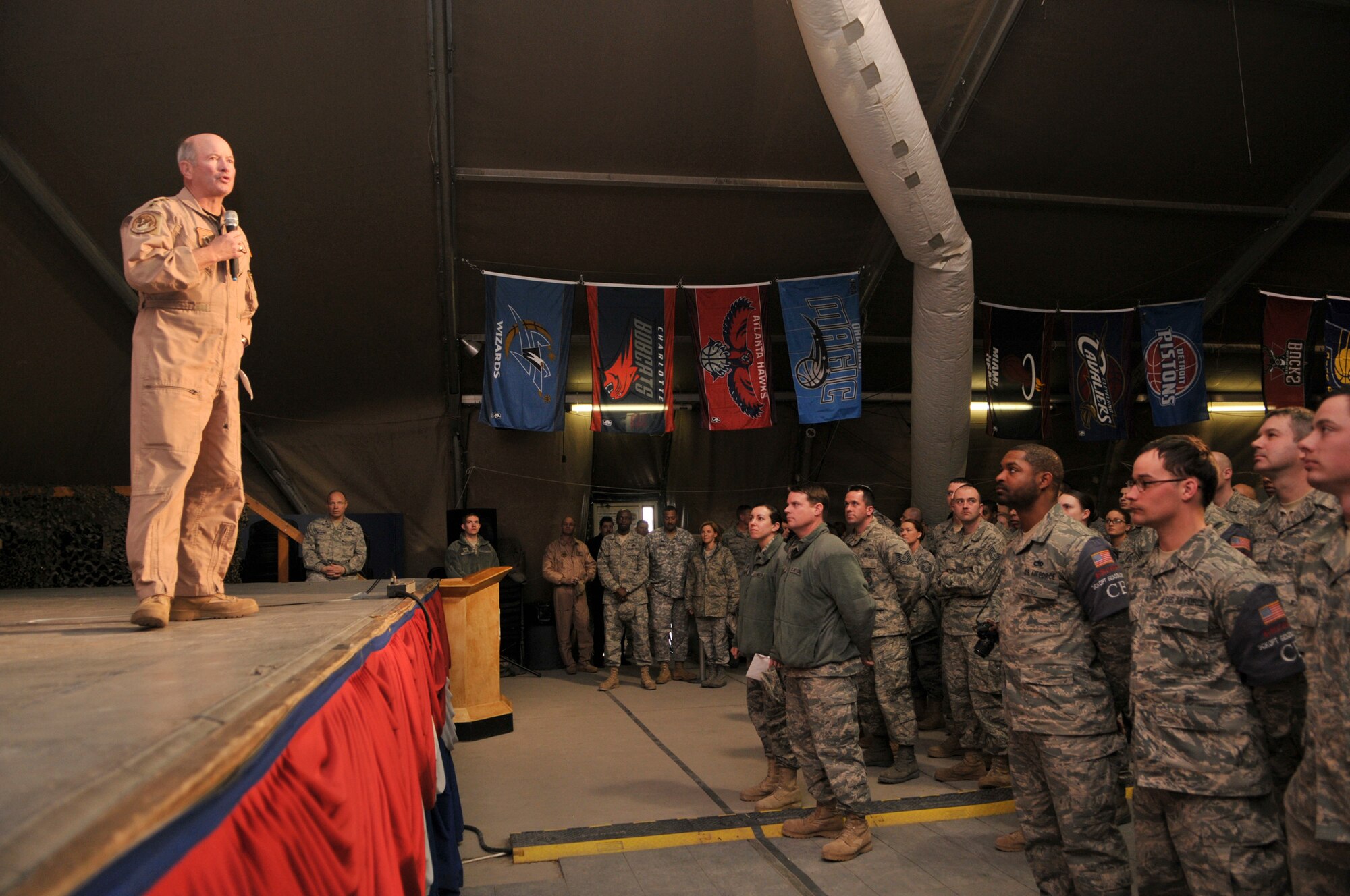 TRANSIT CENTER AT MANAS, Kyrgyzstan - Gen. Duncan McNabb, commander, U.S.Transportation Command,spends time at the Transit Center at Manas, March 3. During his visit, General McNabb reviewed the transit center operations, surveyed the flight line and talked with the troops. The day ended with an "All Hands" at Pete's Place where he thanked the servicemen and women for their sacrifices. (U.S. Air Force photo/Staff Sgt. Stacy Moless)
