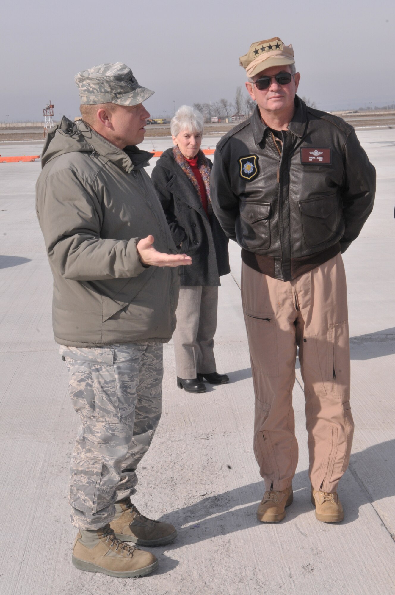 TRANSIT CENTER AT MANAS, Kyrgyzstan - Gen. Duncan McNabb, commander, U.S. Transportation Command, talks with Col. Brian Brandner, vice commander, at the Transit Center at Manas, March 3. During his visit, General McNabb reviewed the transit center operations, surveyed the flight line and talked with the troops. The day ended with an "All Hands" at Pete's Place where he thanked the servicemen and women for their sacrifices. (U.S. Air Force photo/Staff Sgt. Stacy Moless)
)
