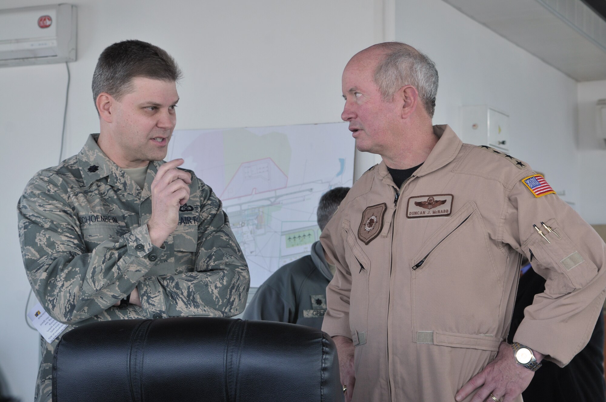 TRANSIT CENTER AT MANAS, Kyrgyzstan - Gen. Duncan McNabb, commander, U.S.Transportation Command, spends time at the Transit Center at Manas, March 3. During his visit, General McNabb reviewed the transit center operations, surveyed the flight line and talked with the troops. The day ended with an "All Hands" at Pete's Place where he thanked the servicemen and women for their sacrifices. (U.S. Air Force photo/Staff Sgt. Stacy Moless)