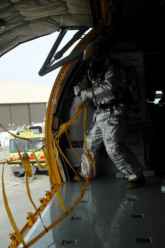 GRISSOM AIR RESERVE BASE, Ind. -- 434th Civil Engineer Squadron firefighter ensures equipment on a KC-135R Stratotanker is put back into place after completing a fire egress training exercises on the airfield here recently. (U.S. Air Force photo/Senior Airman Damon Kasberg)