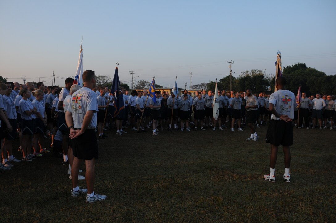 SOTO CANO AIR BASE, Honduras -- Joint Task Force-Bravo Army Forces Command Sgt. Maj. Donald Goines addresses personnel after completing their monthly run here, Mar. 4. Soldiers, Sailors, Airmen and Marines participated in a nearly three-mile run exhibiting their physical readiness. The monthly run encourages esprit de corps and physical fitness. Physical Fitness is paramount to mission success.(U.S. Air Force photo/Staff Sgt. Kimberly Rae Moore)