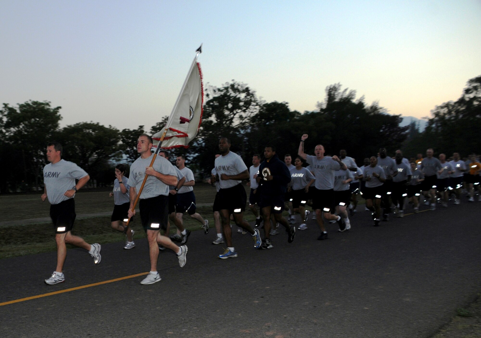 SOTO CANO AIR BASE, Honduras -- Joint Task Force-Bravo Army Forces commander Lt. Col. Craig Gendreau leads the unit during the monthly formation run Mar. 4. JTF-Bravo Soldiers, Sailors, Airmen and Marines participated in the nearly three-mile run, exhibiting their physical readiness. (U.S. Air Force photo/Staff Sgt. Kimberly Rae Moore)