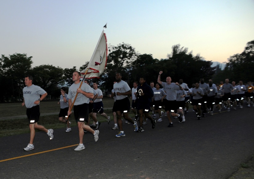 SOTO CANO AIR BASE, Honduras -- Joint Task Force-Bravo Army Forces commander Lt. Col. Craig Gendreau leads the unit during the monthly formation run Mar. 4. JTF-Bravo Soldiers, Sailors, Airmen and Marines participated in the nearly three-mile run, exhibiting their physical readiness. (U.S. Air Force photo/Staff Sgt. Kimberly Rae Moore)