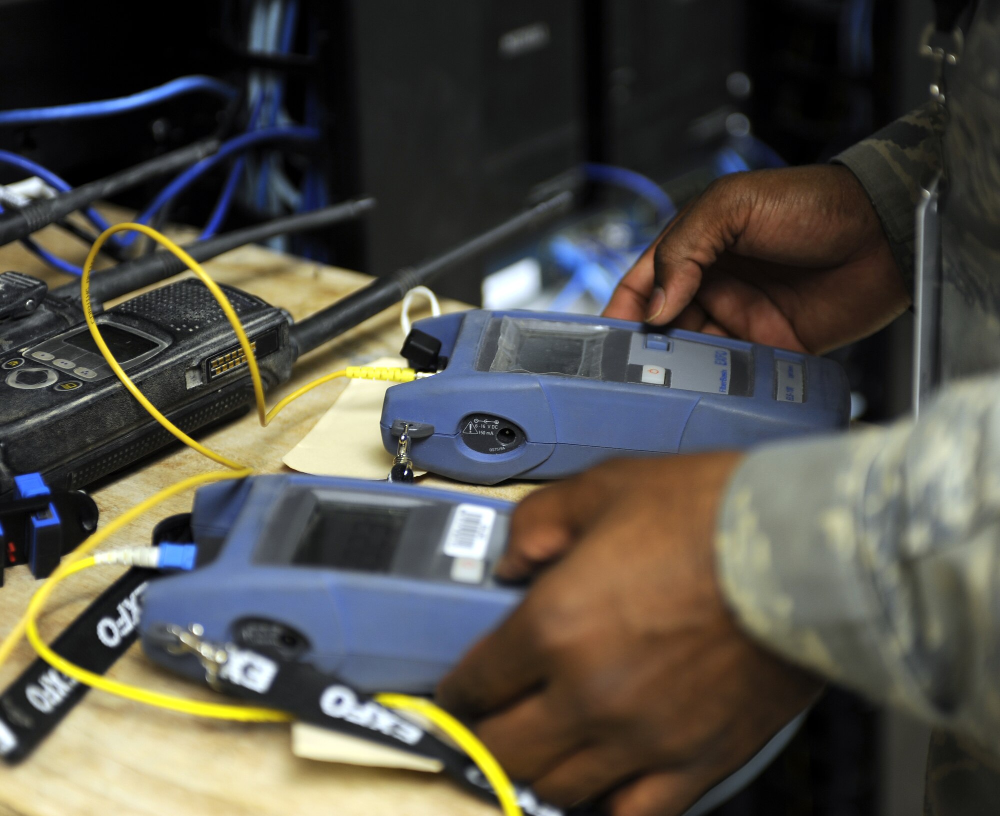 Staff Sgt. Eugene Hunter tests fiber optic cable with a power meter, March 2, 2011, at Kandahar Airfield, Afghanistan. Sergeant Hunter shines light down the cable and tests the brightness at the other end. If the cable retains the intensity of the light it is serviceable. Sergeant Hunter is an engineering and installation team member assigned to the 451st Expeditionary Communications Squadron. (U.S. Air Force photo/Senior Airman Willard E. Grande II/Released)