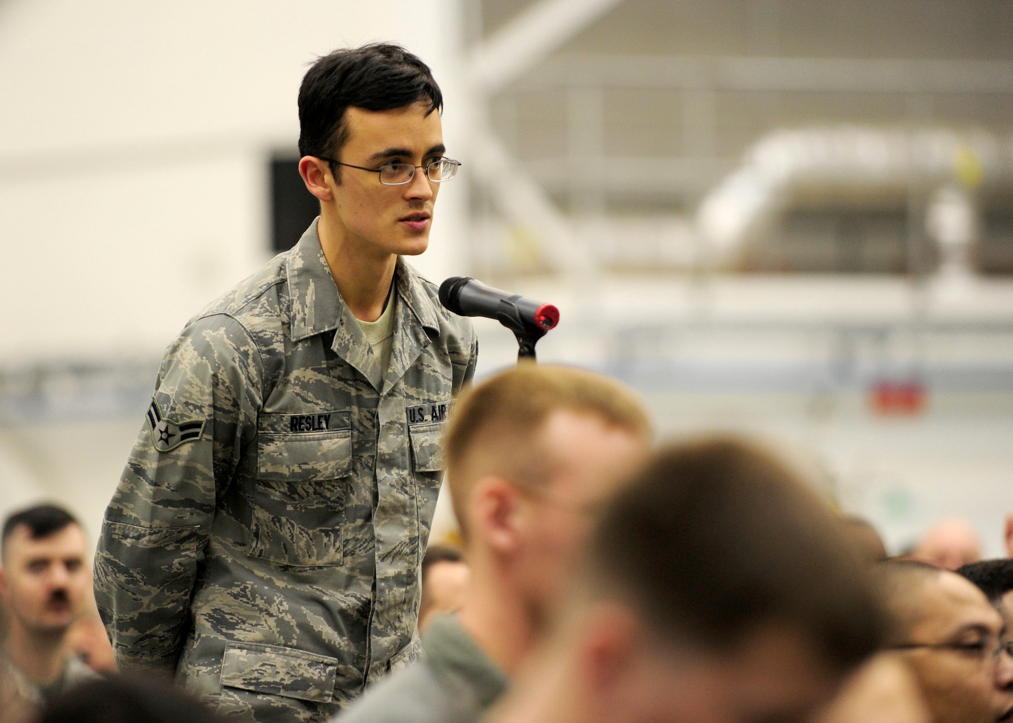 RAF MILDENHALL, England – Airman 1st Class Nicholas Resley, 100th Communications Squadron, poses a question to Gen. Mark Welsh, U.S. Air Forces in Europe commander, during a question and answer session at an all-call here, March 2, 2011. This is the general’s first visit to RAF Mildenhall since taking command of USAFE in December. (U.S. Air Force photo/Staff Sgt. Jerry Fleshman)