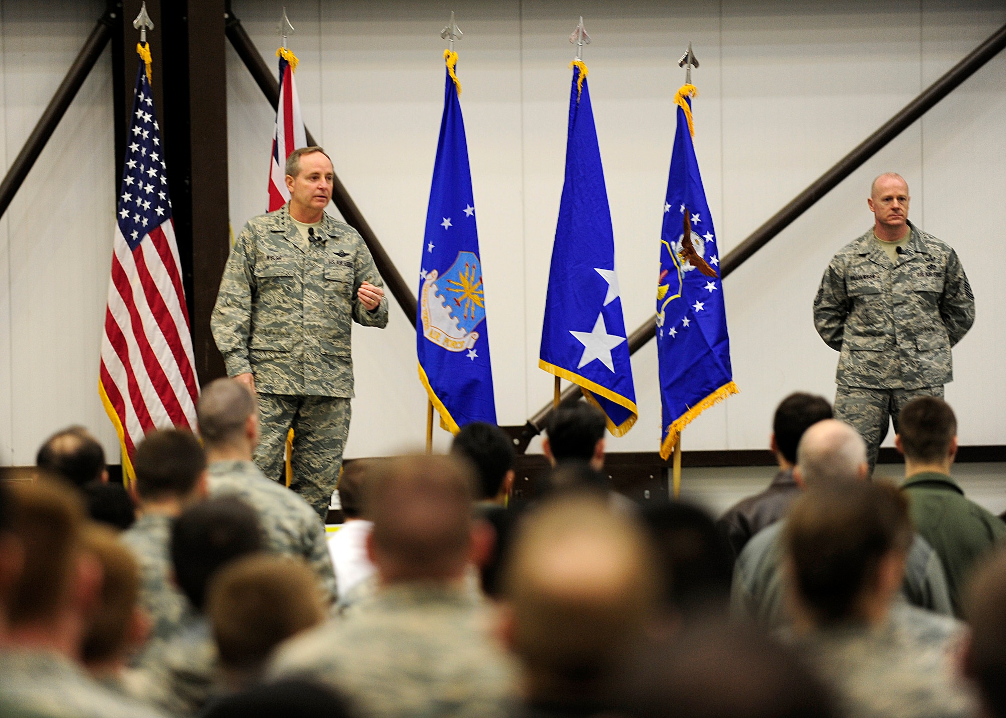 RAF MILDENHALL, England -- Gen. Mark Welsh, U.S. Air Forces in Europe commander, addresses Team Mildenhall during an all-call here, March 2, 2011, as Chief Master Sgt. David Williamson, USAFE command chief, looks on. This is the general’s first visit to RAF Mildenhall since taking command of USAFE in December. (U.S. Air Force photo/Staff Sgt. Jerry Fleshman)